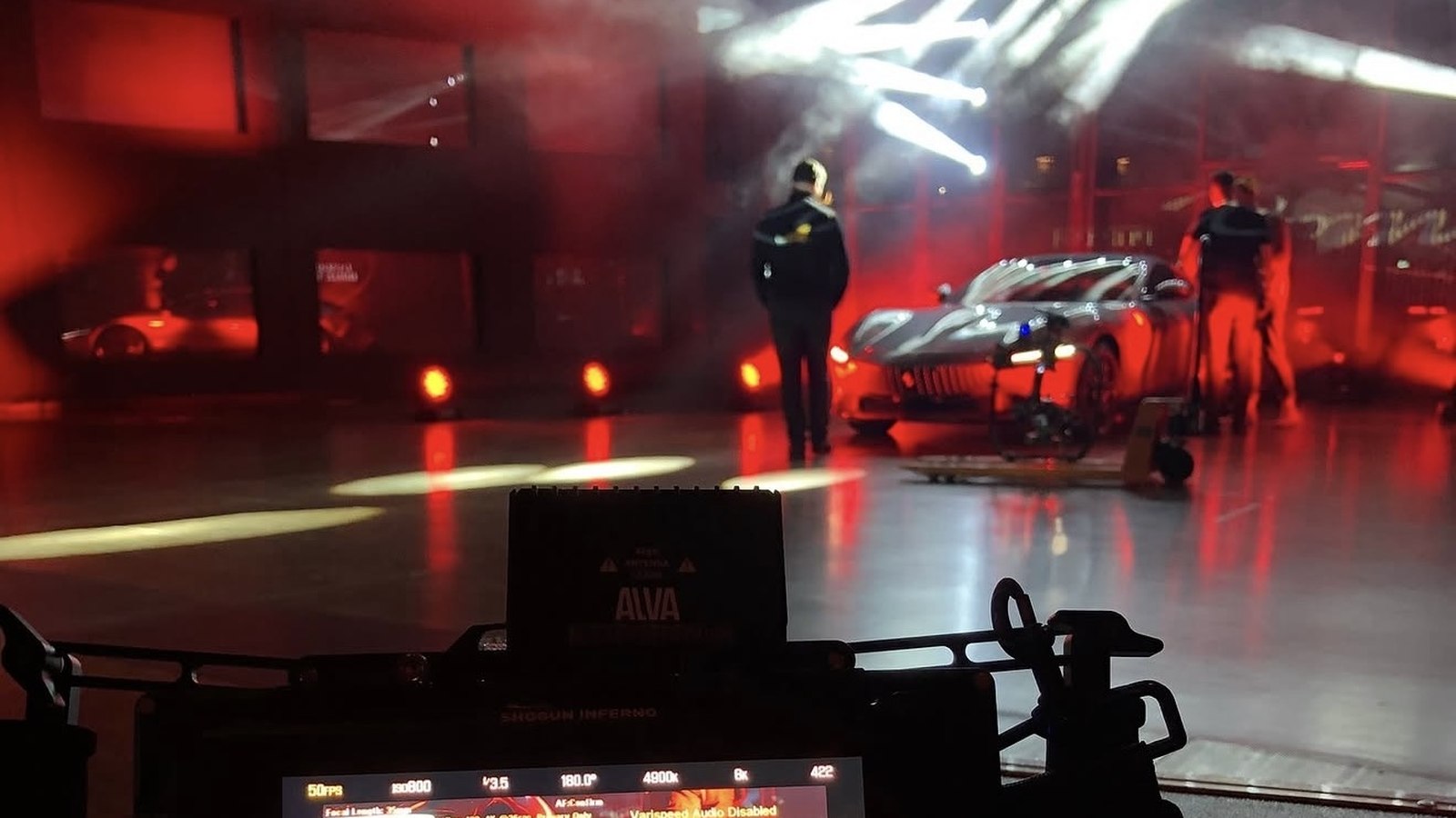 Pixer cinema camera monitor showing a supercar on set — behind the scenes at a high-end brand production
